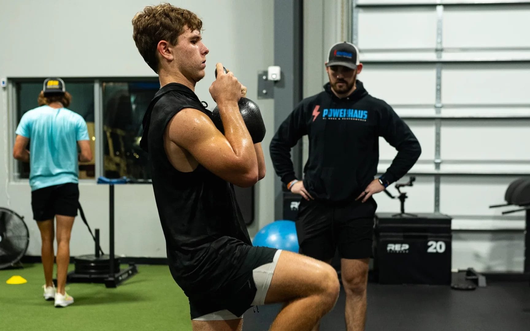 man hold kettlebell