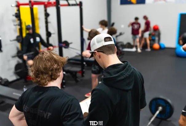 two mans looks at training